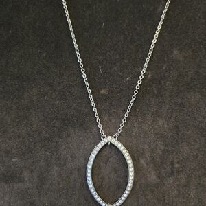 Givenchy Light Topaz colored blue stone set in dark gunmetal colored chain